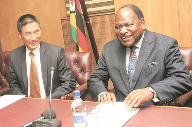 Chief Secretary to the President and Cabinet Dr Misheck Sibanda and Indian Ambassador to Zimbabwe Mr Masakui Rungsung share a lighter moment during the handover ceremony of a One Million United States dollars drought relief grant and food aid from the government of India to Zimbabwe in Harare.-Picture by Munyaradzi Chamalimba