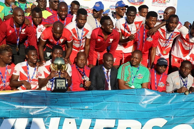 Triangle players lift the Chibuku Super Cup trophy at Gibbo Stadium