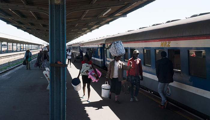 Passengers disembark from a train in Bulawayo, Zimbabwe (Picture by CLAIRE HARBAGE / NPR)