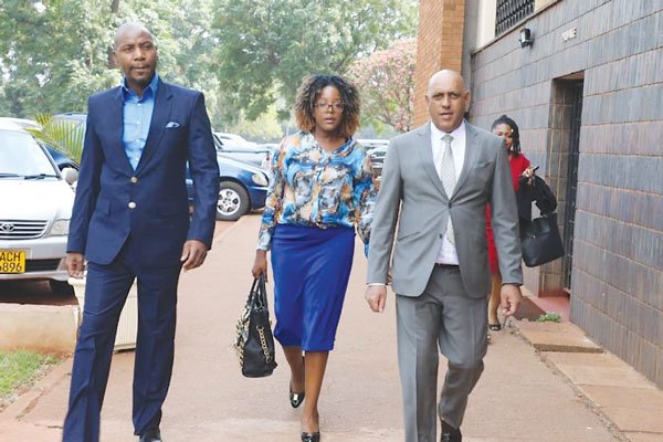 Former President Robert Mugabe's son-in-law Simba Chikowore (left) and his wife Bona at the Harare Magistrates' Courts (Picture by NewsDay)