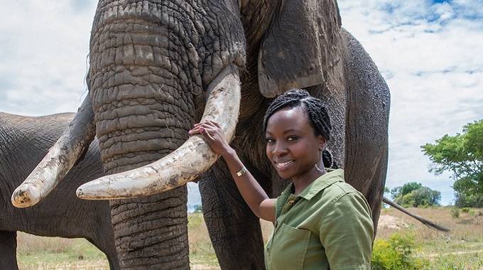 Danai poses with elephants recently