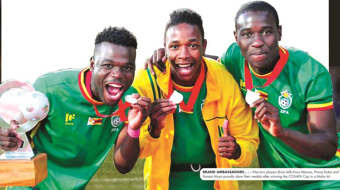 BRAND AMBASSADORS . . . Warriors players from (left) Knox Mtizwa, Prince Dube and Honest Moyo proudly show their medals after winning the COSAFA Cup in Mafro kit