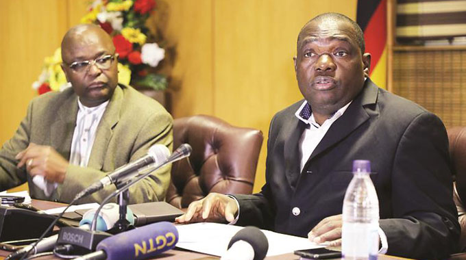 Foreign Affairs and International Trade Minister Dr Sibusiso Moyo addresses the media while flanked by head of Europe and Americas Ambassador Chitsaka Chipaziwa (left) in Harare (August 2018). — (Picture by Memory Mangombe)
