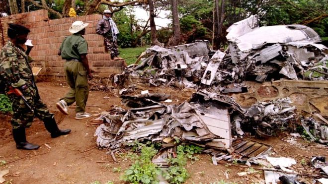 Rwanda Patriotic Front (RPF) rebels inspect the wreckage of the plane in which Rwandan president Juvenal Habyarimana was in.