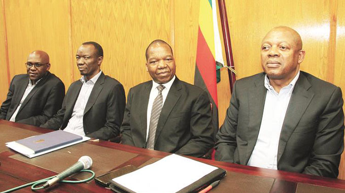 Delta Corporation chief executive Mr Pearson Gowero (right) addresses journalists at a Press conference at Munhumutapa Building, while flanked by (from left) Delta operations director Mr Maxen Karombo, Delta finance director Mr Matlhogonolo Valela and Reserve Bank of Zimbabwe Governor Dr John Mangudya. — Picture by Kudakwashe Hunda