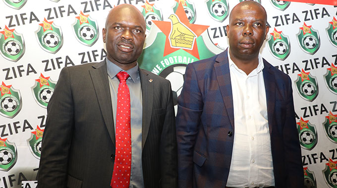 JUST A MONTH AGO . . . ZIFA vice president Gift Banda (right) and the association’s boss Felton Kamambo pose for cameras after they were voted in as the two most powerful men in domestic football in Harare on December 16