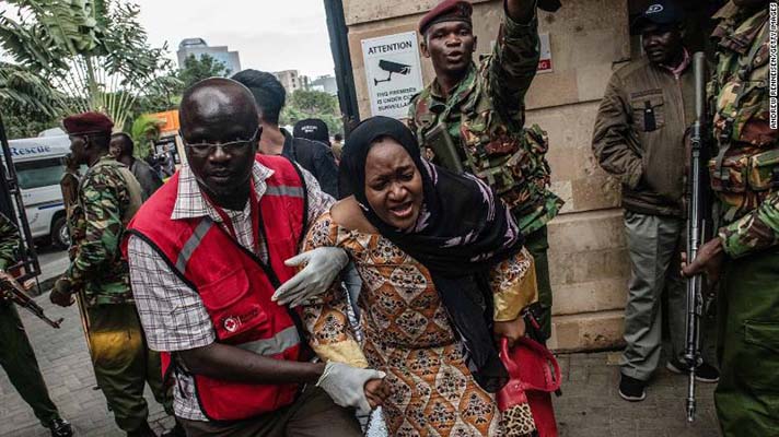 A woman is rescued from the Dusit Hotel on January 15, 2018 in Nairobi, Kenya. A current security operation is underway after terrorists attacked the hotel.