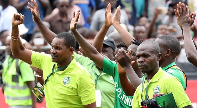 FC Platinum coach Norman Mapeza, backroom staff and players salute supporters at the end of CAF league match against Orlando Pirates at Barbourfields Stadium in Bulawayo.(Picture by Eliah Saushoma)