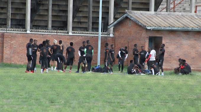 Highlanders players stage a sit-in and refuse to train yesterday at Barbourfields Stadium