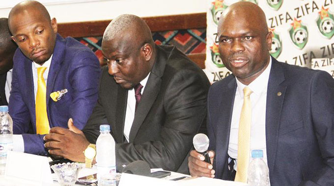 DEAL DONE . . . ZIFA president Felton Kamambo (right) addresses the media in Harare yesterday in the company of board members Sugar Chagonda (middle) and Chamu Chiwanza at a briefing where he announced the new Umbro kit deal for national teams