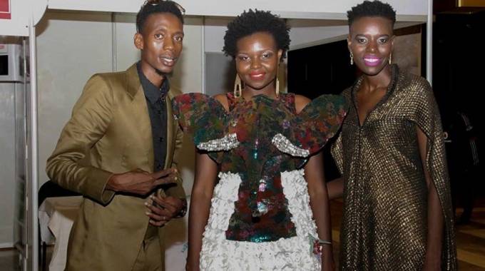Selmor and Sandra Mtukudzi with fashion designer Thembani Mubochwa (far left)