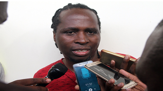 Charles Mhlauri being interviewed by journalists