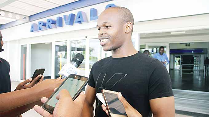 Warriors skipper Knowledge Musona fields questions from local media soon after his arrival at the Robert Gabriel Mugabe International Airport