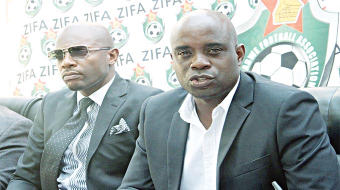 Under-23 coach Tonderai Ndiraya (right) addresses the media during a Press conference yesterday at Zifa House in Harare while Zifa board member Chamu Chiwanza follows proceedings