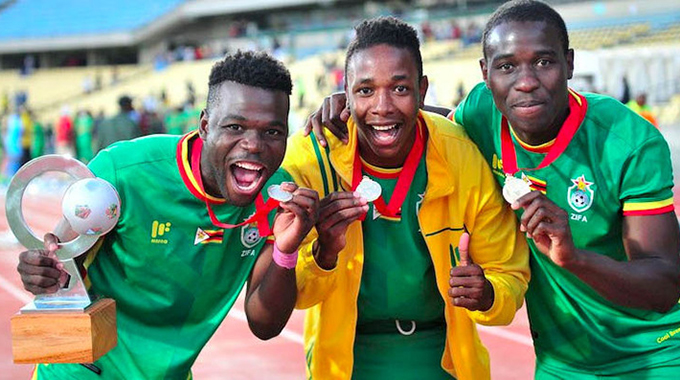 TRIUMPHANT WARRIORS . . . Members of the victorious Zimbabwe senior men’s national team (from left) Knox Mutizwa, Prince Dube and Honest Moyo celebrate winning the COSAFA Cup last year in South Africa