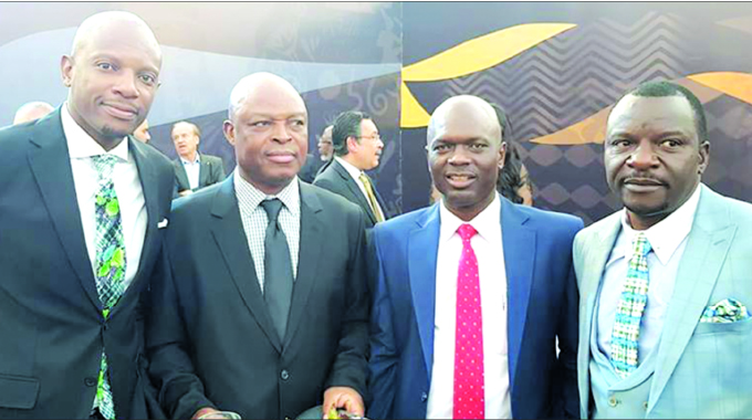 Sunday Chidzambwa (second from left), seen here in the company of (from left) ZIFA board member Chamu Chiwanza, association president Felton Kamambo and Warriors team manager Wellington Mpandare at the 2019 AFCON draw in Cairo, Egypt