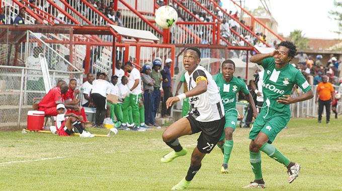 EYES ON THE BALL . . . Prince Dube evades his marker