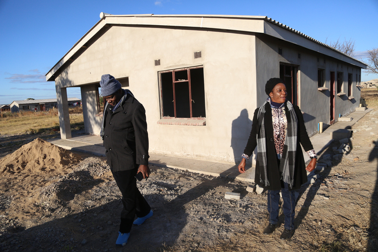River Valley Properties Chairman Mr Mncedisi Dude and the company’s CEO Mrs Dude at a house they built for the former owner of the peri-urban farm which was repossessed for resettlement in Woodlands Phase 2