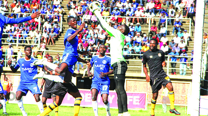 NO WAY OUT . . . Hwange goalkeeper Taimon Mvula thwarts another Dynamos raid during yesterday’s Castle Lager Premiership football match at Rufaro yesterday. — Picture by Kuda Hunda