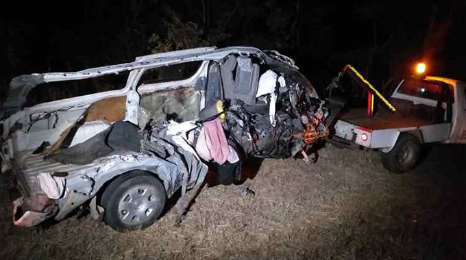 A truck tows away the kombi in which 10 people were crushed to death 25km outside Gweru yesterday evening