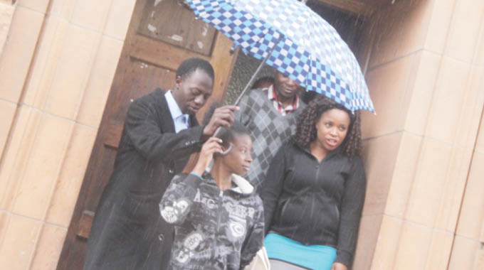 Oscar Sibanda (left) and Theresa Kumbota (extreme right)