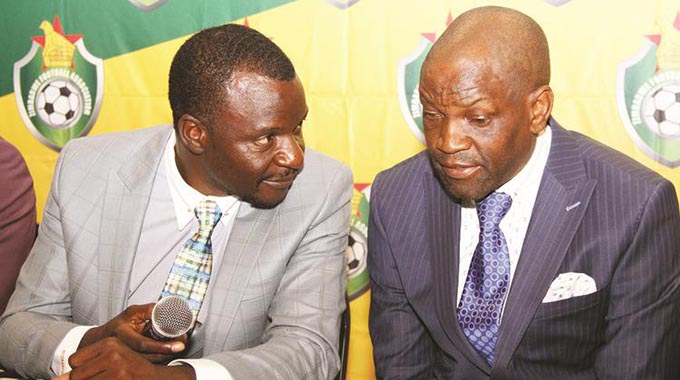 NATIONAL DUTY . . . Warriors team manager Wellington Mpandare (left) and assistant coach Lloyd Mutasa discuss a point during yesterday’s media conference where the provisional squad for the 2019 AFCON and COSAFA Cup was unveiled