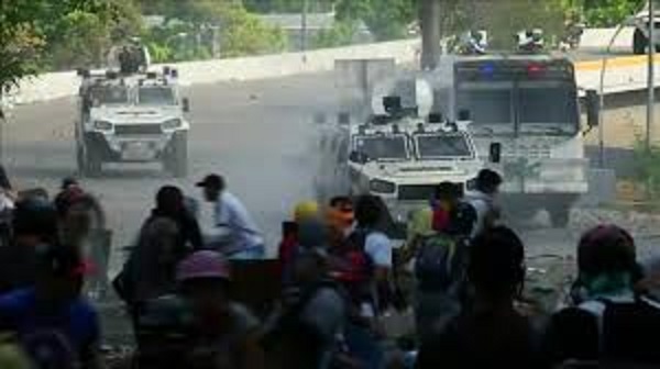 Tear gas and water cannon hit Venezuela protesters on Wednesday