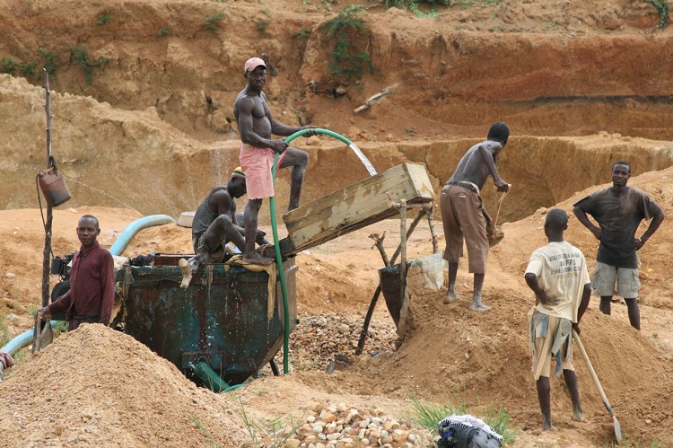 In this file photo, artisanal miners going about their work