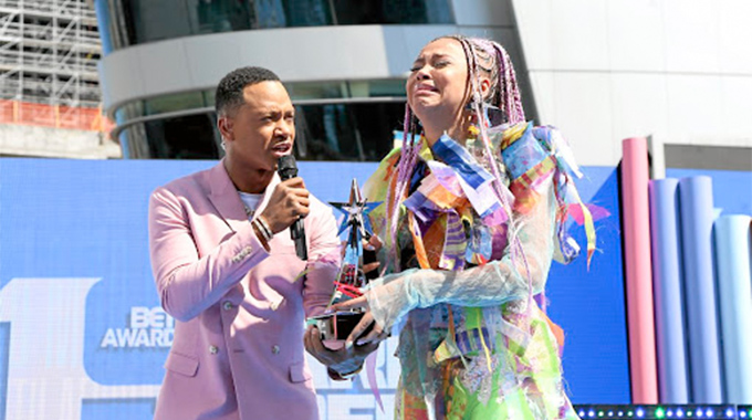 cries as she receives her BET award on Sunday night