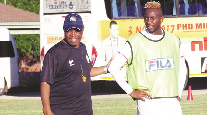 (FILE) THE MASTER AND HIS PUPIL . . . Warriors coach Sunday Chidzambwa (left) gives some notes to midfielder Tafadzwa Kutinyu during a training session in Harare