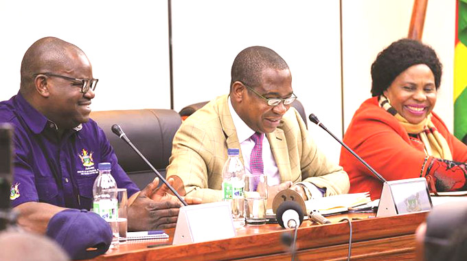 Finance and Economic Development Minister Professor Mthuli Ncube (centre) is flanked by Information, Publicity and Broadcasting Services Minister Monica Mutsvangwa (right) and Secretary Mr Nick Mangwana during an informal interaction with the media in Harare. — Picture by John Manzongo