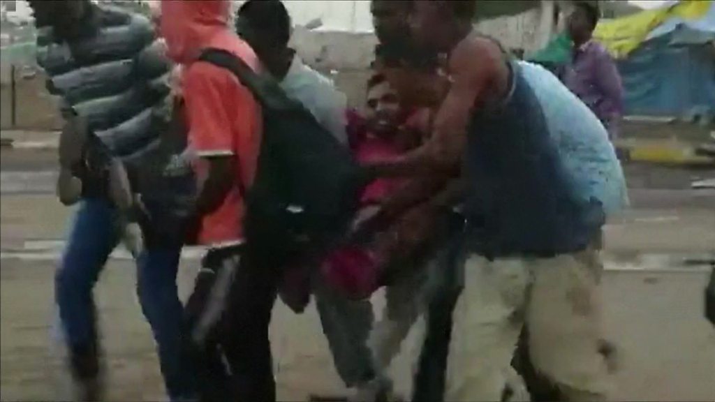 Gunfire can be heard as protesters flee