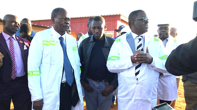 Energy and Power Development Minister Fortune Chasi (right) and Minister of State for Matabeleland South Abedinico Ncube (left) view the Gwanda solar project site