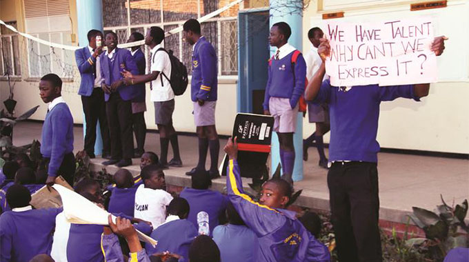 Cranborne Boys High School pupils protest against alleged poor administration and mismanagement of funds at their school in Harare yesterday. — Picture by Edward Zvemisha