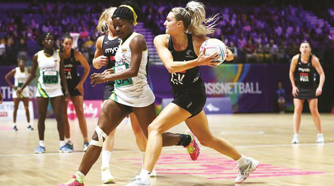 UNDER SIEGE . . . Zimbabwe’s goal attack Ursula Ndlovu (centre) fights for the ball with New Zealand’s goal keeper Jo Weston during yesterday’s first fixture of the Preliminaries Stage Two Group F of the 2019 Vitality World Cup at the M & S Bank Arena in Liverpool, England. Zimbabwe lost 36-79 but will be determined to get back to winning ways when they take on Barbados today in their next game before taking on Malawi on Thursday