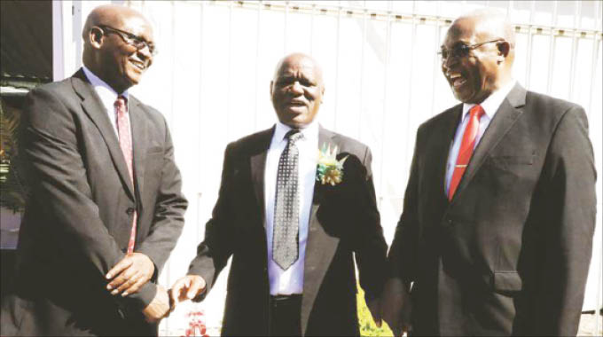 Chief Justice, Luke Malaba (centre), shares a lighter moment with newly sworn in Supreme Court judges, Nicholas Mathonsi (left) and Charles Hungwe (right) in Harare yesterday. — Picture by Memory Mangombe