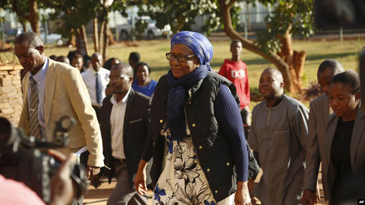 Former Zimbabwe Tourism and Environment Minister Prisca Mupfumira, center, arrives at court in Harare (Picture by AP)