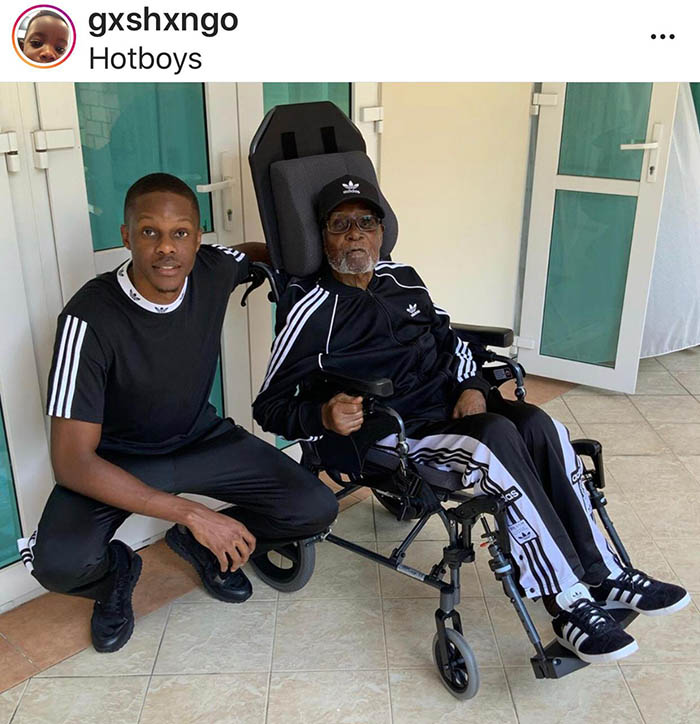 In his latest Instagram post Robert Junior posts a picture of his 95-year-old father wearing a full adidas tracksuit while seated on a wheelchair.