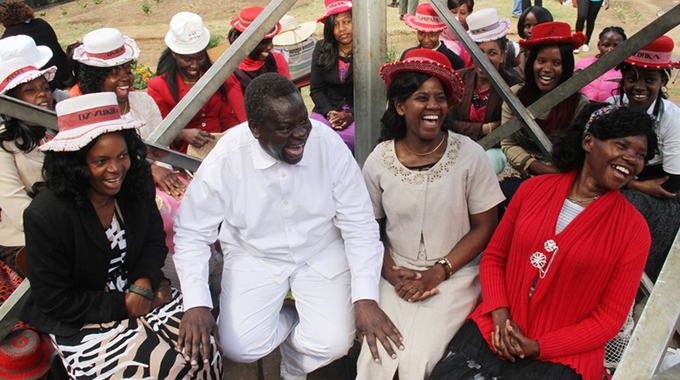 Jailed RMG Independent End Time Message leader Robert Martin Gumbura share a lighter moment with wives (putting on hats) and relatives at Chikurubi Maximum prison in Harare yesterday. It is Family week and people are free to visit their incarcerated relatives – Picture by Kudakwashe Hunda