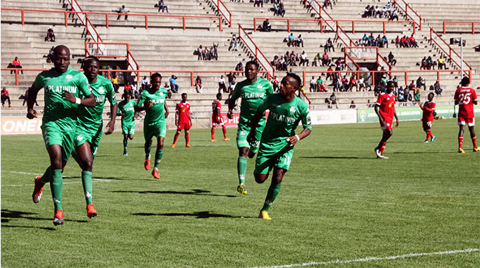 FC Platinum’s Devon Chafa (left) is joined in celebration by his teammates after scoring a penalty against Nyasa Big Bullets from Malawi during a Caf Champions League match played at Barbourfields Stadium (Picture by Nkosizile Sdlovu)