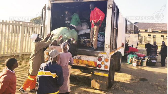 Zimbabweans who have volunteered to come home load their wares at Tsolo Hall in Katlegong under Ekhurhuleni City, South Africa. — Picture: Thupeyo Mleya