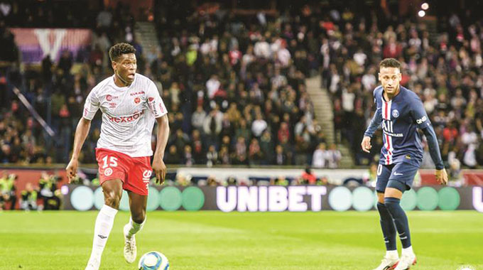 HIGH-FLYING WARRIOR . . . Zimbabwe international midfielder Marshall Munetsi produced a man-of-the-match performance at the Parc des Princes on Wednesday night as his French side Stade Reims shocked Paris Saint-Germain 2-0 in a Ligue 1 match. — (Picture by Stade Reims)