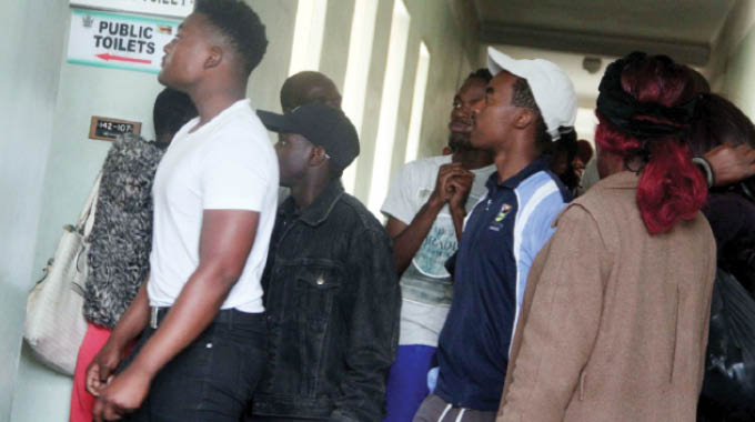 Some of the Nust students being taken to the court’s holding cells as they appeared at the Bulawayo Magistrates’ Courts housed at Tredgold Building on Tuesday