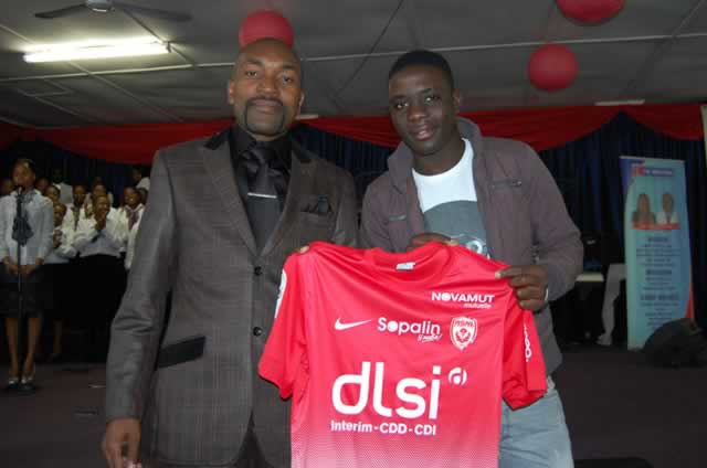 Then French side AS Nancy midfielder Marvellous Nakamba presenting his club jersey to Prophet Blessing Chiza at Eagle Life Ministries during a Sunday service in 2014