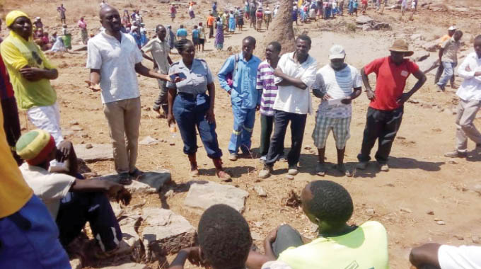 People from Change area at a scene where a fellow villager’s body was found following an attack by elephants on Friday