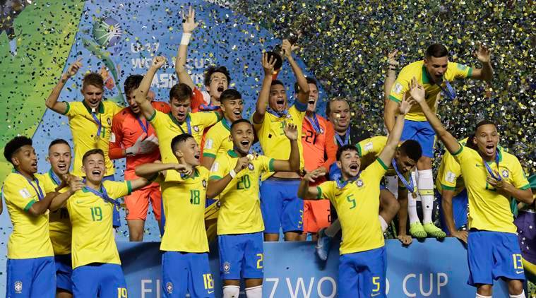 Brazilian players celebrate after their team's 2-1 victory over Mexico at the end of FIFA U-17 World Cup Brazil 2019 final soccer match at Arena Bezerrao in Brasilia, Brazil, Sunday, Nov. 17, 2019. (AP Photo/Eraldo Peres)