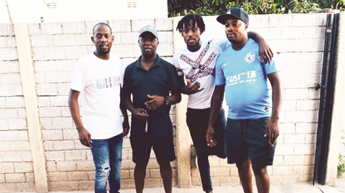 BACK IN THE GHETTO . . . France-based Zimbabwe international footballer Tino Kadewere (second from right), who is back in the country for the Christmas holidays, enjoys the company of his brothers (from left) Pardon, Prosper and Prince at their family home in Egypt, Highfield
