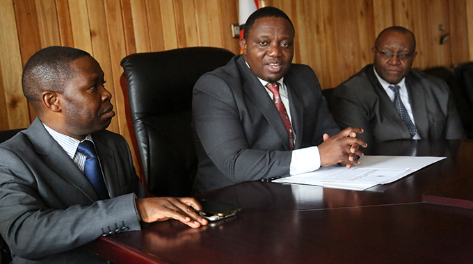 Home Affairs and Cultural Heritage Minister Kazembe Kazembe gives an update on the current passport situation in Harare. Flanking him are his deputy Mike Madiro (far right) and the Registrar-General Clement Masango. - Picture: Believe Nyakudjara