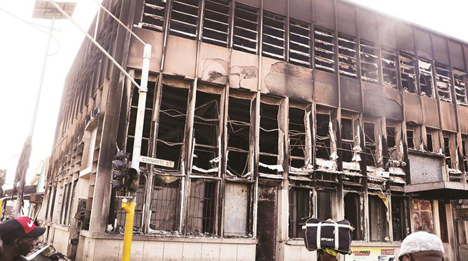 Traders at a new shopping mall at corner Robert Mugabe Road and Chinhoyi Street in Harare were left counting their losses after goods worth thousands of dollars were destroyed by fire yesterday.— Picture: Justin Mutenda