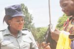 Top cop ‘drills’ married subordinate . . . Hands over ‘underwear gift’ as token to lover’s hubby Ebony Nyoni (right) shows Asst Insp Masuku the underwear gift from Insp Masuku